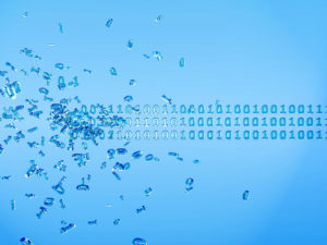 data destruction concept illustrated by dissolving code
