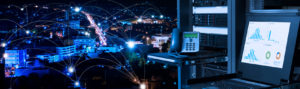IT services depicted by data center, monitoring screen and network connections throughout city at night
