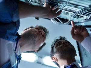 two network engineers working on data center migration