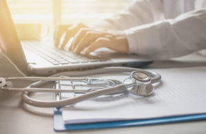 medical professional using computer